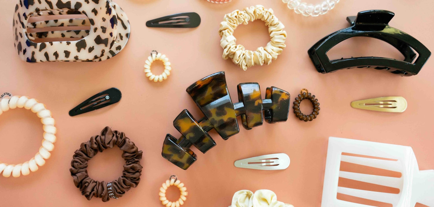 Collection of hair accessories, including hair clips and scrunchies 