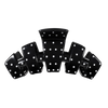 TELETIES large hair claw clip in glossy black with a white polka dot pattern, designed for secure styling.
