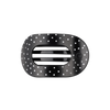 TELETIES medium flat round hair clip in black with a white polka dot pattern, designed for comfortable leaning.
