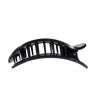 TELETIES large flat round hair clip in black with white polka dots, designed for comfortable reclining.
