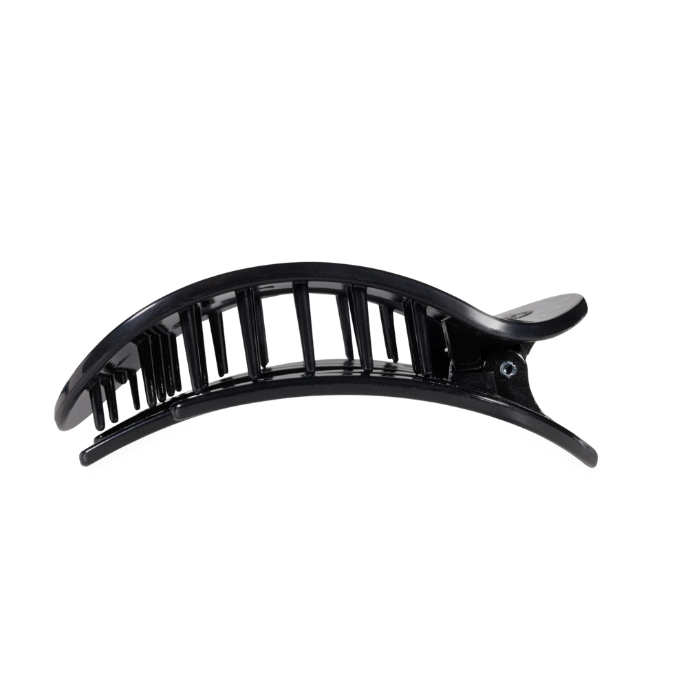 TELETIES large flat round hair clip in black with white polka dots, designed for comfortable reclining.
