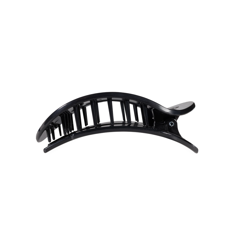 TELETIES medium flat round hair clip in black with a white polka dot pattern, designed for comfortable wear.
