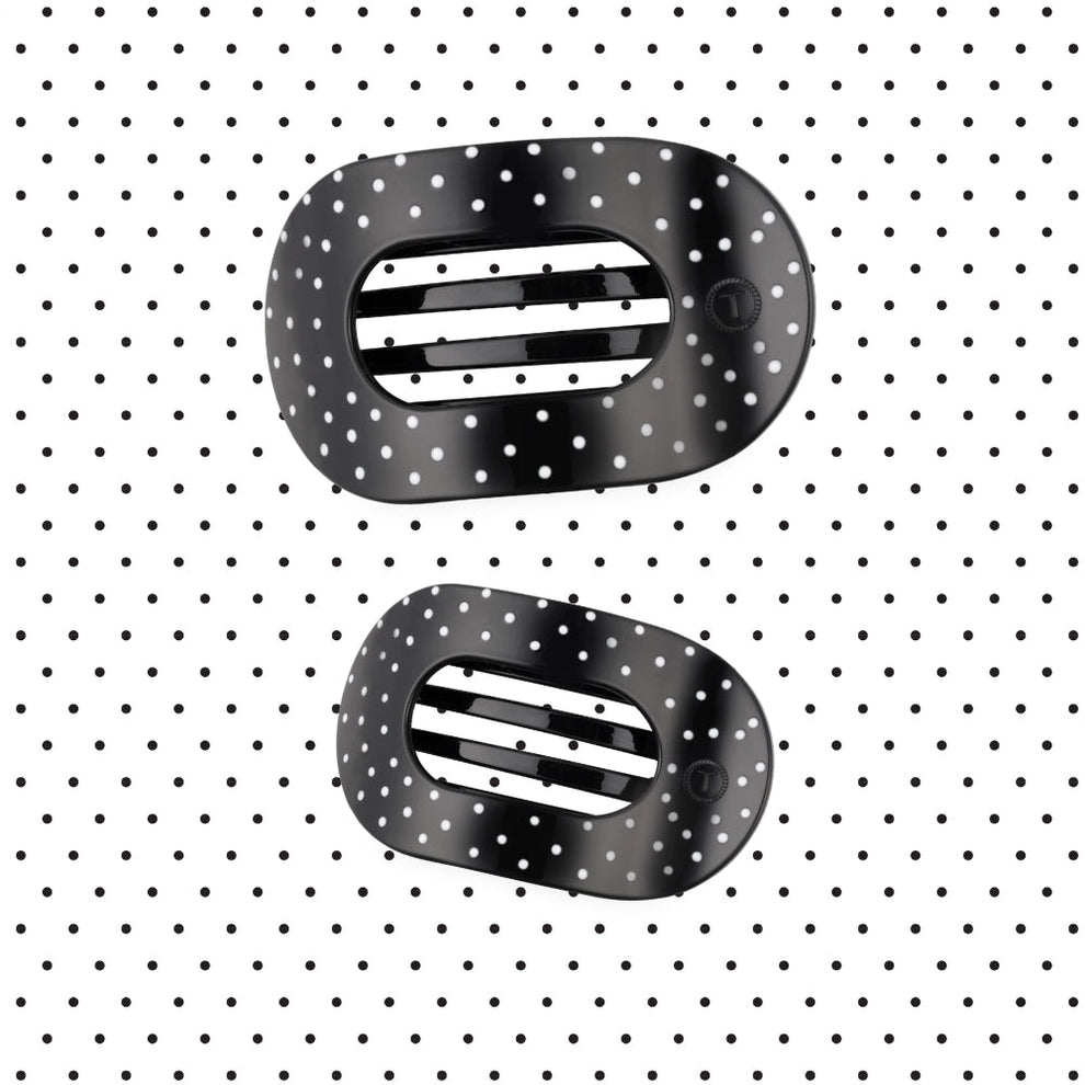 TELETIES medium flat round hair clips in black with white polka dot print on a matching polka dot background.
