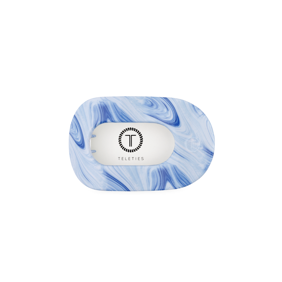 TELETIES small flat round hair clip in blue marble pattern with bendable teeth for a comfortable, secure hold.
