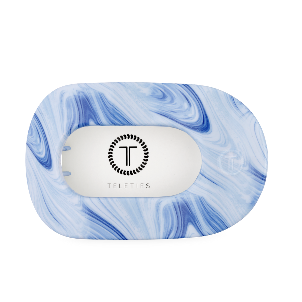 TELETIES blue marbled large flat round hair clip with bendable teeth for a secure hold.
