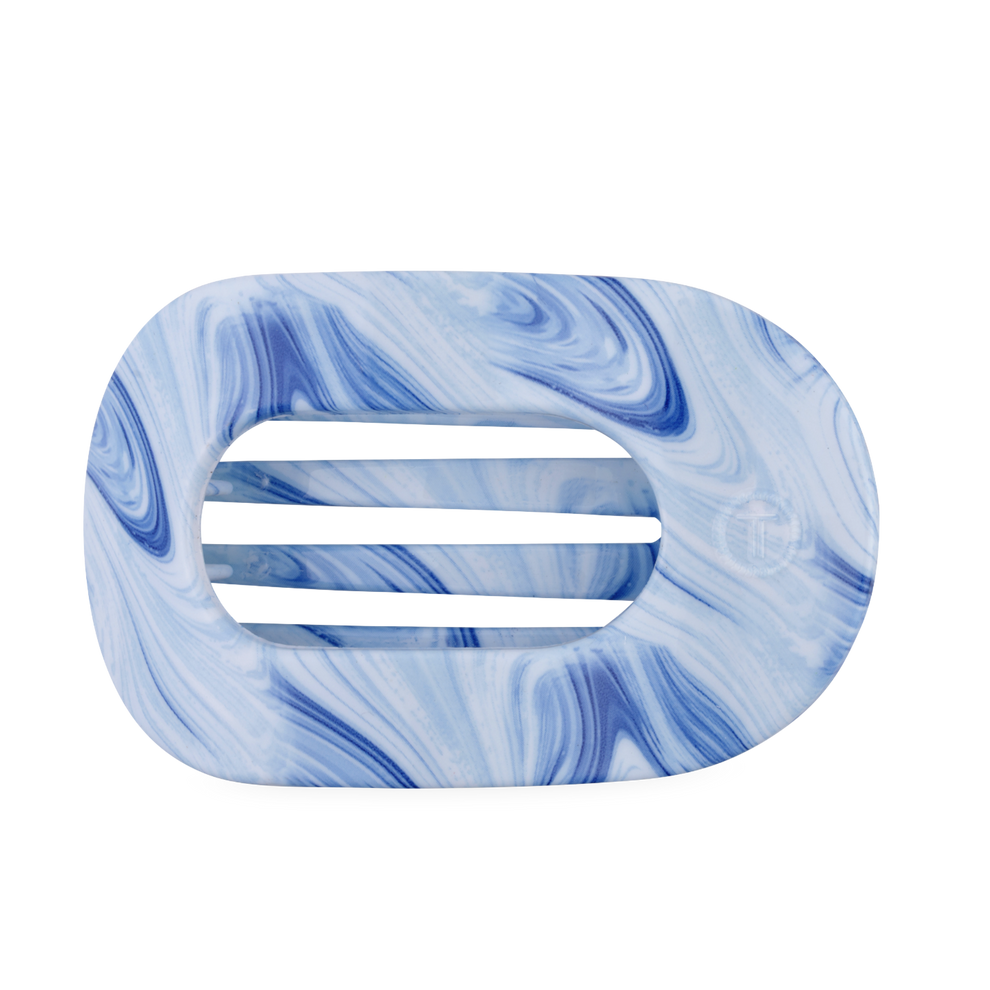 TELETIES blue marbled large flat round hair clip with bendable teeth for a secure hold.
