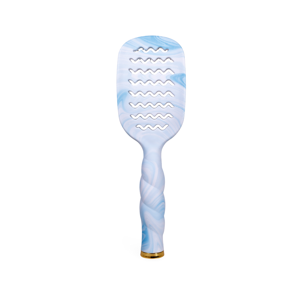 TELETIES blue tie-dye vented hair brush with wavy cutouts and a twisted handle.
