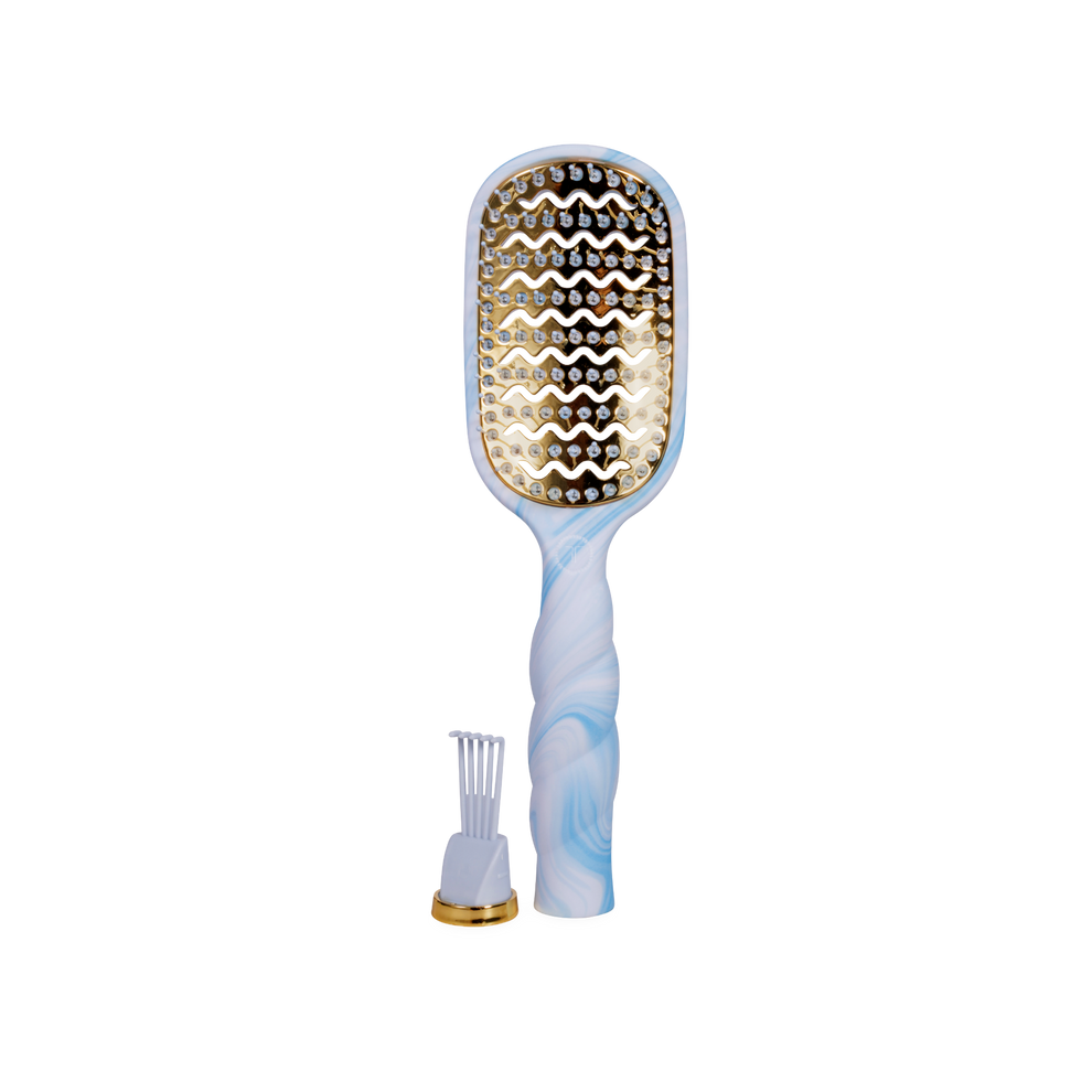 TELETIES blue and white tie-dye vented hair brush with gold accents and a detachable cleaning tool.
