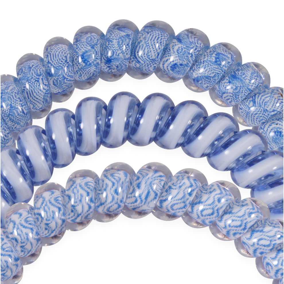 TELETIES blue and white spiral hair ties with a patterned design and a swirled design, gentle on hair.
