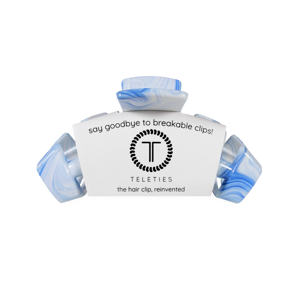TELETIES blue and white marbled medium claw clip with bendable teeth for a secure hold.
