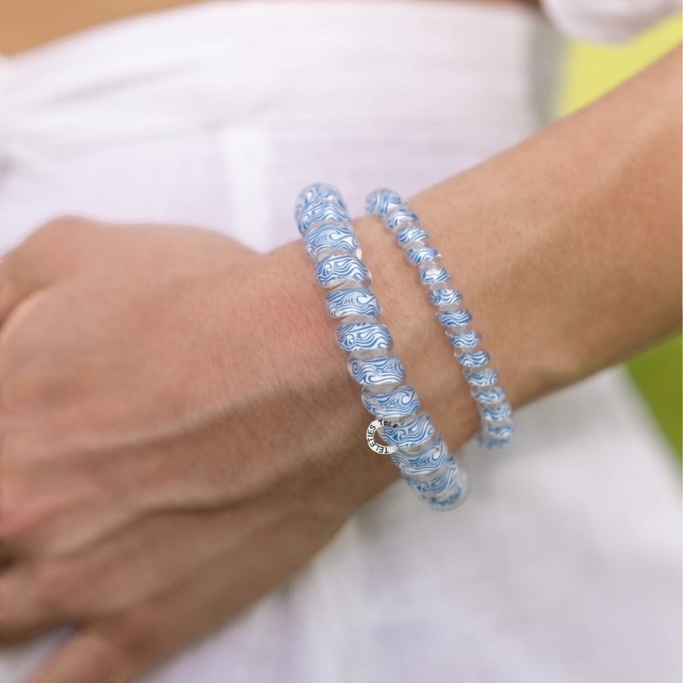 TELETIES blue and white swirled large hair ties, sold in packs of three, also wearable as bracelets.
