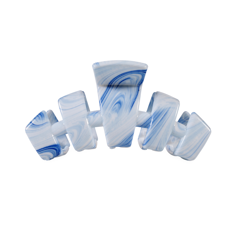 TELETIES blue and white swirled medium claw clip with bendable teeth for a secure hold.
