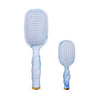 TELETIES blue and white tie-dye detangler hair brush bundle with gold accents.
