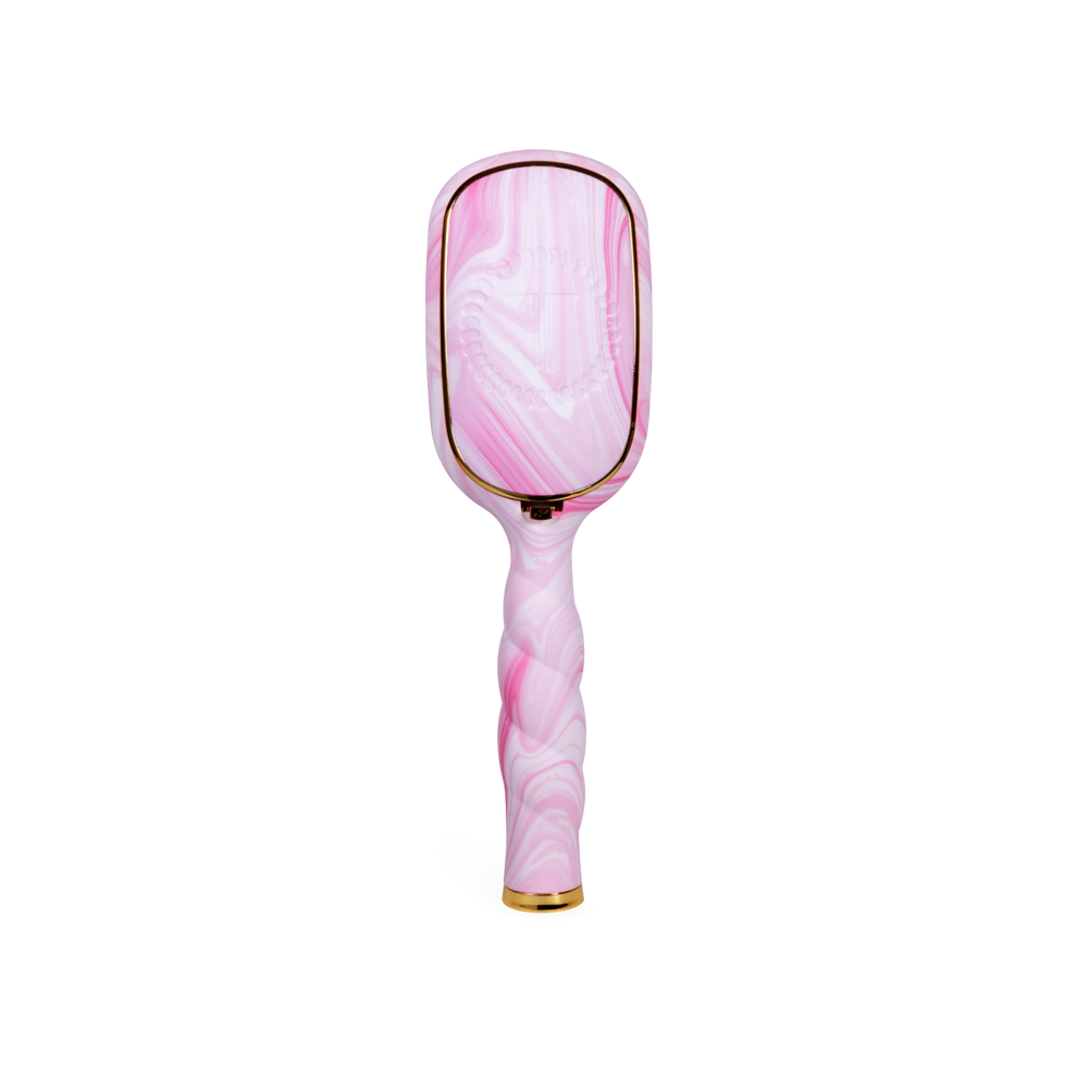 TELETIES pink and white tie-dye boar bristle hair brush with gold trim and ergonomic coil handle.
