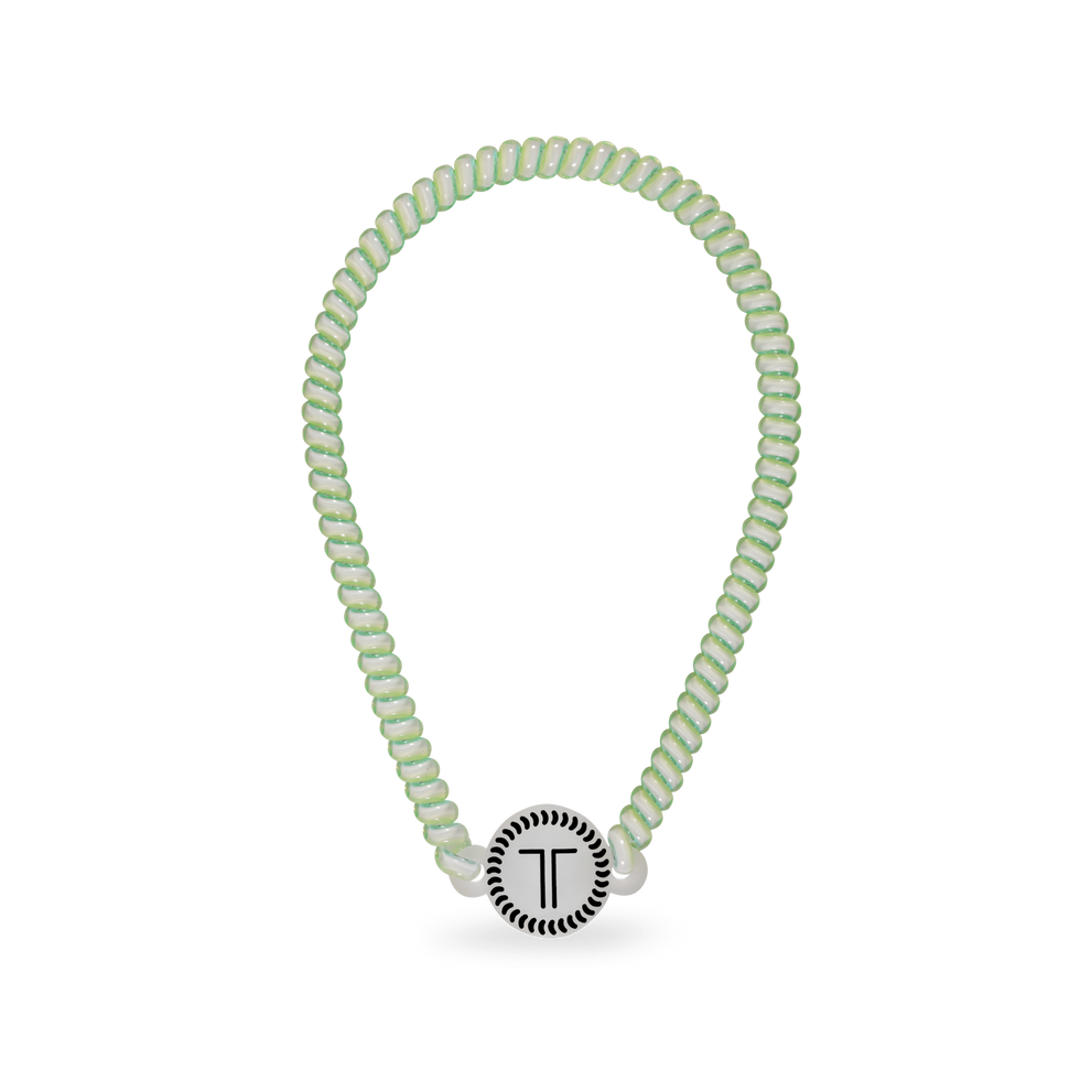 TELETIES By the Sea Shore Headband in light green with spiral design and no-slip rubber stopper.
