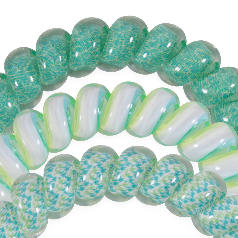 TELETIES By the Sea Shore Large Hair Ties in green and white swirled pattern and a blue-green geometric pattern. Coil design.
