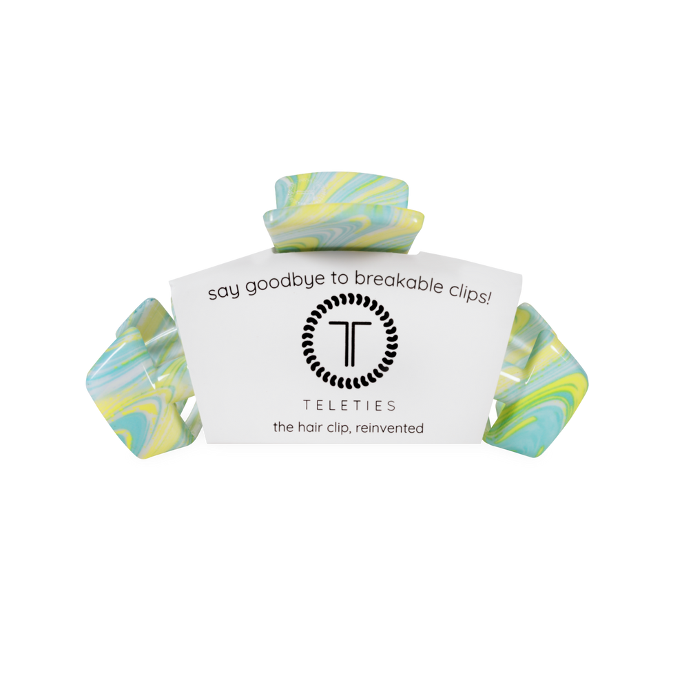 TELETIES By the Sea Shore Medium Claw Clip in swirled blue, yellow, and white marbled acetate. Bendable teeth for a secure hold.
