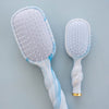 TELETIES blue and white swirled detangler hair brush bundle, handmade with unique patterns.

