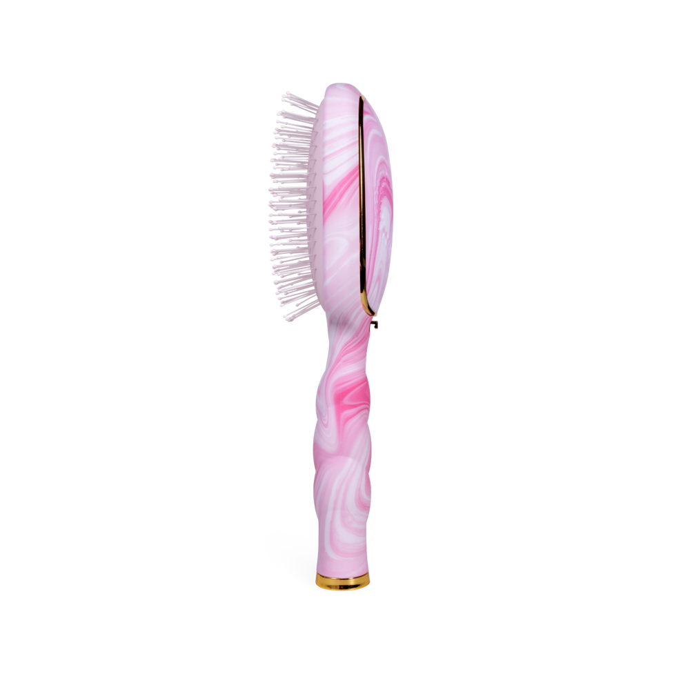 TELETIES pink and white tie-dye detangler hair brush with gold trim and white bristles. Ergonomic handle.
