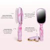 TELETIES pink and white tie-dye detangler hair brush with built-in mirror and storage, and removable cleaner.
