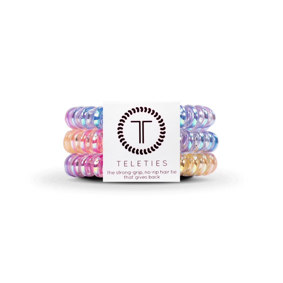 TELETIES small spiral hair ties in multicolor, iridescent pink, yellow, and blue. Doubles as a bracelet. Waterproof. Strong grip no ripping.
