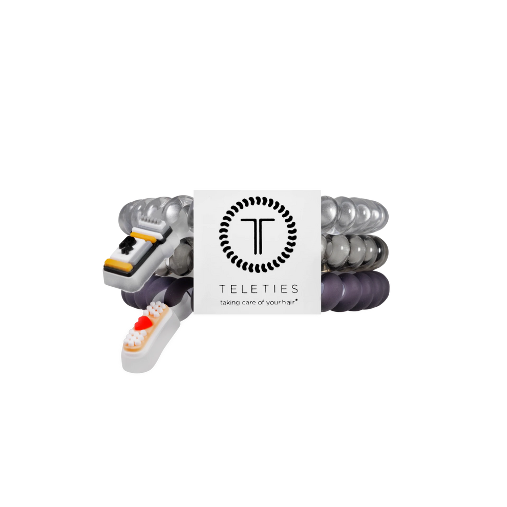 TELETIES Good Hair Rx small hair ties in grey and black with medical-themed charms on a white branded display card

