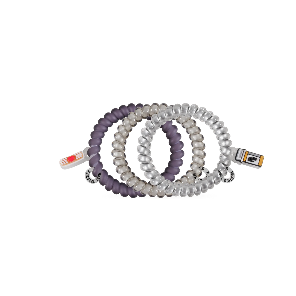TELETIES Good Hair Rx small spiral hair ties in purple and silver with medical-themed charms on a white background

