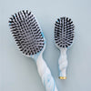 TELETIES Tide & True Boar Bristle Hair Brush Bundle with blue and white swirl pattern handles and black bristles.
