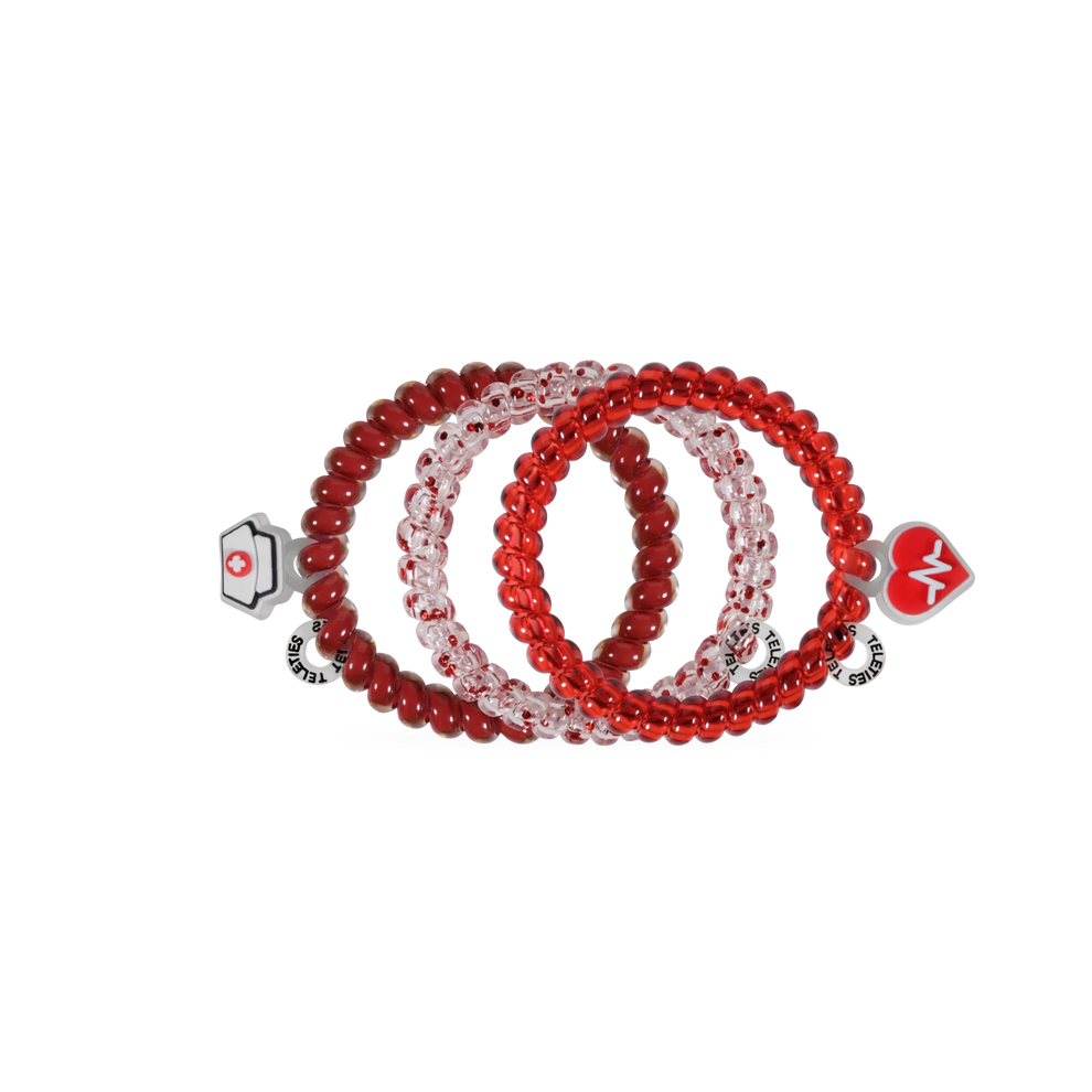TELETIES Heart and Hustle small spiral hair ties in red and clear with nurse cap and heart EKG charm accents.
