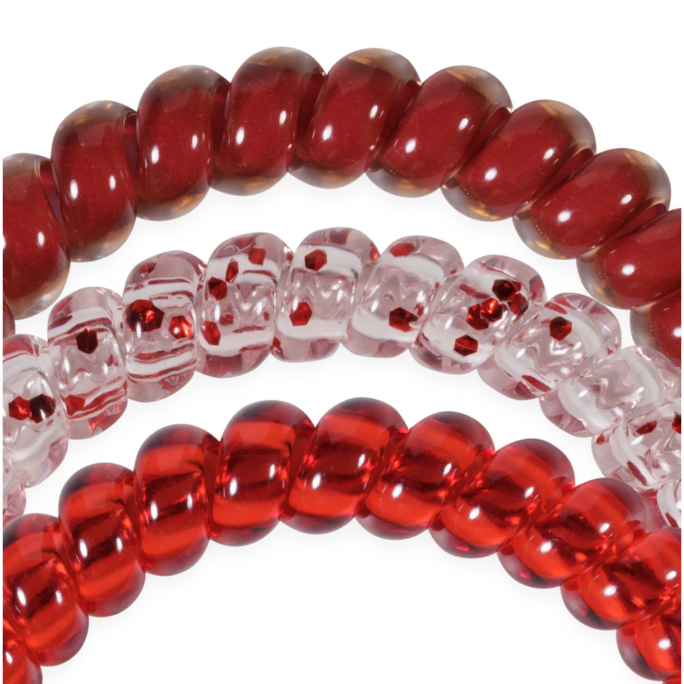 TELETIES Heart and Hustle small spiral hair ties in red and clear with red glitter accents for a secure, no-rip hold.

