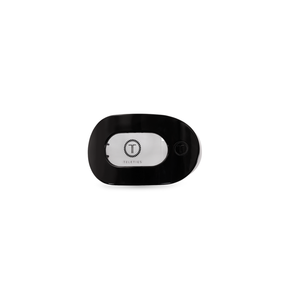 TELETIES jet black tiny flat round hair clip with embossed logo
