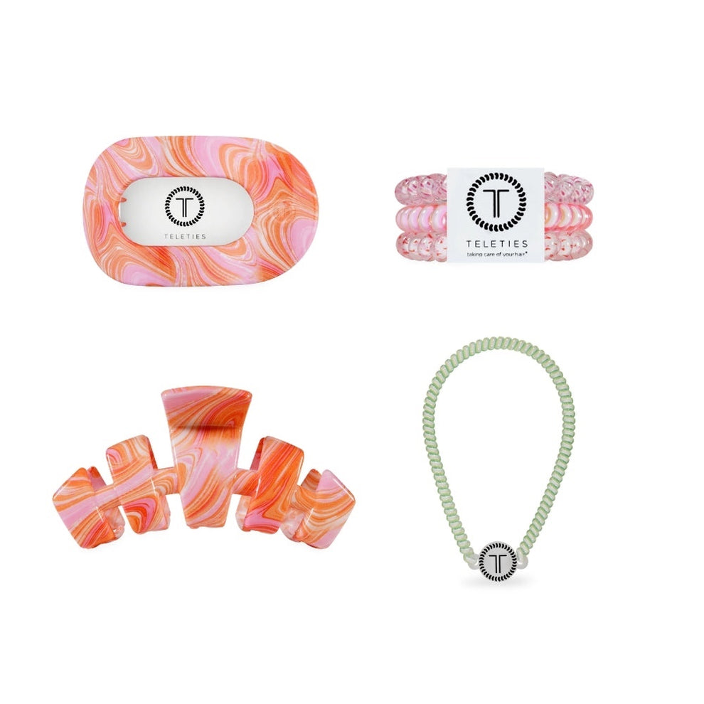 TELETIES Just Keep Swimming Bundle includes pink hair ties, orange and pink marbled hair clips, and a green headband.
