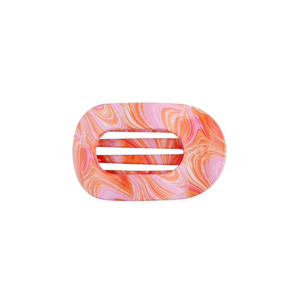 TELETIES Just Keep Swimming small flat round hair clip in pink and orange marble pattern. Bendable teeth.
