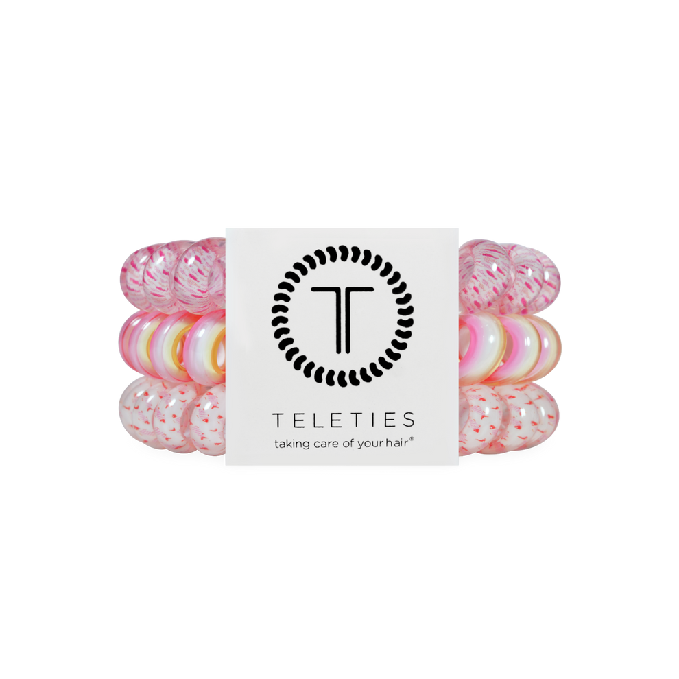 TELETIES Just Keep Swimming large hair ties in pink and white, sold in packs of three. Spiral design prevents damage.
