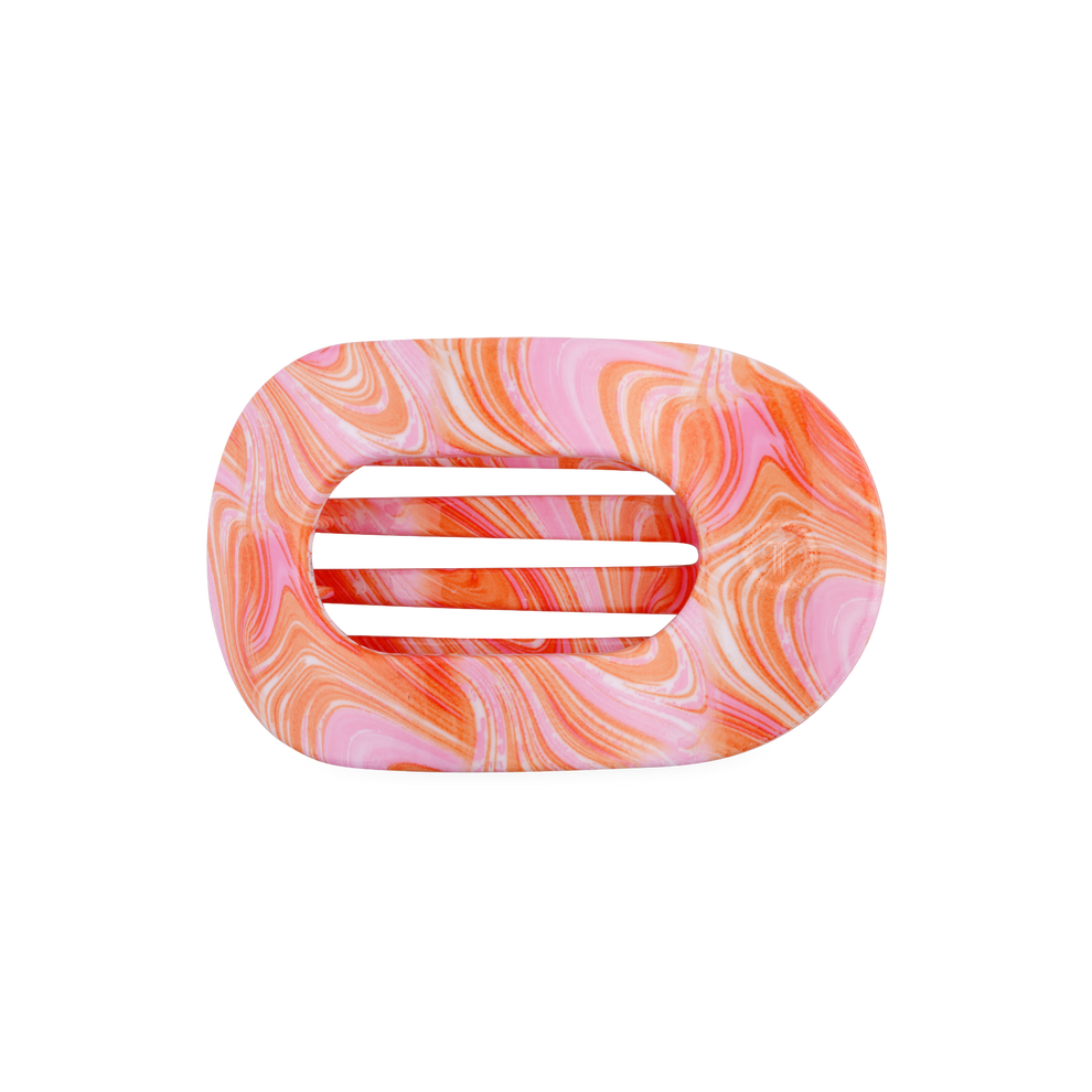 TELETIES Just Keep Swimming medium flat round hair clip in pink and orange marble pattern. Bendable teeth.
