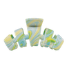 TELETIES By the Sea Shore Large Claw Clip in green with a marbled pattern of yellow, blue, and white. Features bendable teeth for a secure hold.
