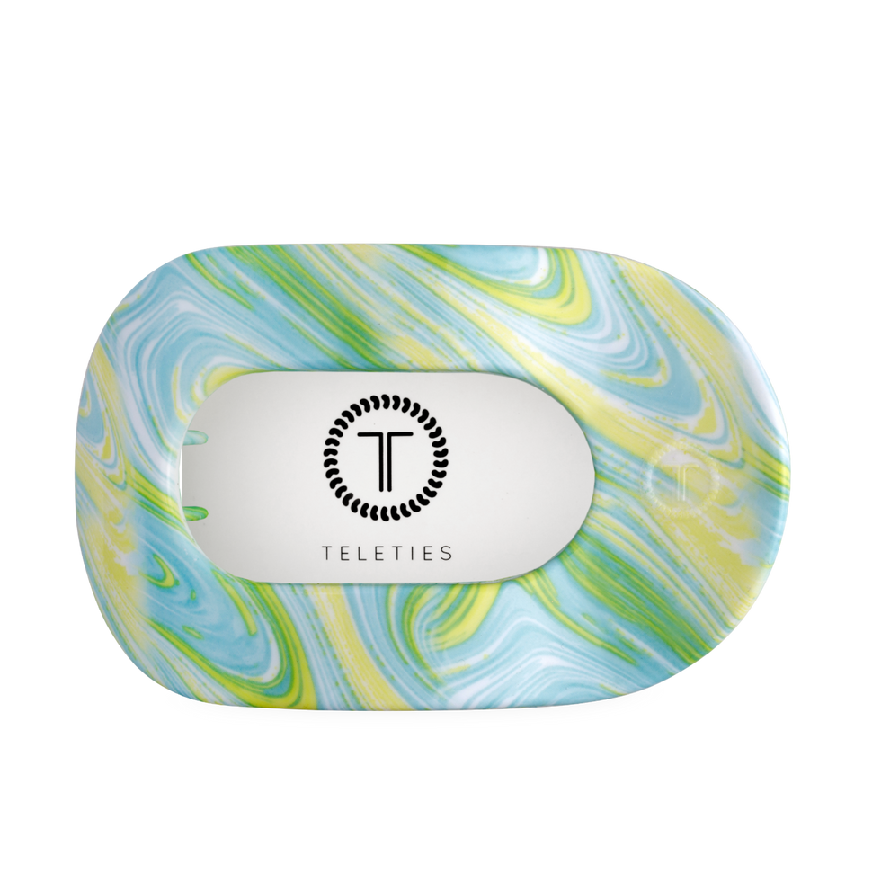 TELETIES By the Sea Shore large flat round hair clip in green, blue, and yellow swirled pattern.
