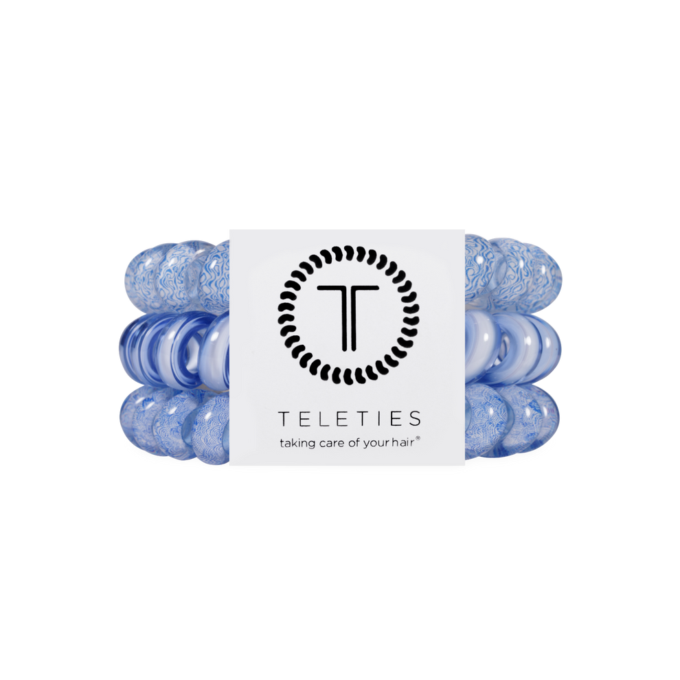 TELETIES blue large spiral hair ties, sold in packs of three. Gentle on hair, waterproof, and doubles as a bracelet.
