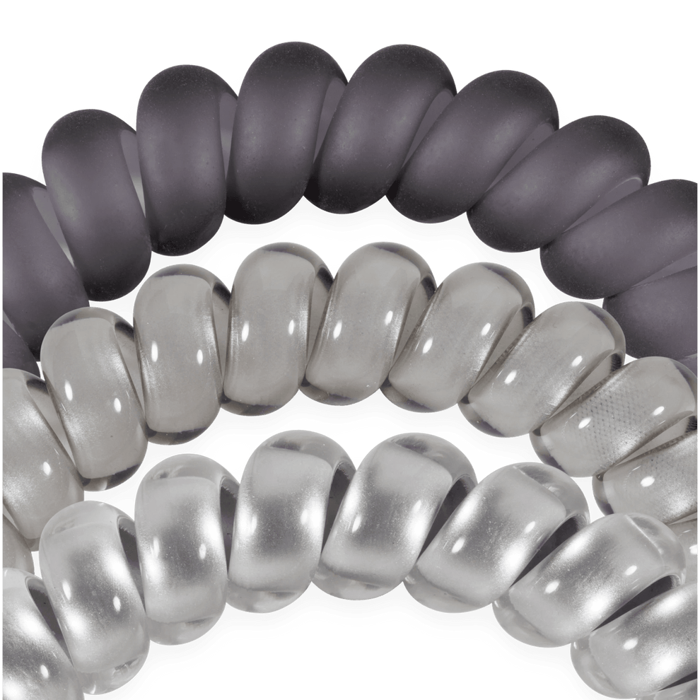 TELETIES Good Hair Rx large spiral hair ties in three shades of grey, designed for a secure, no-crease hold.
