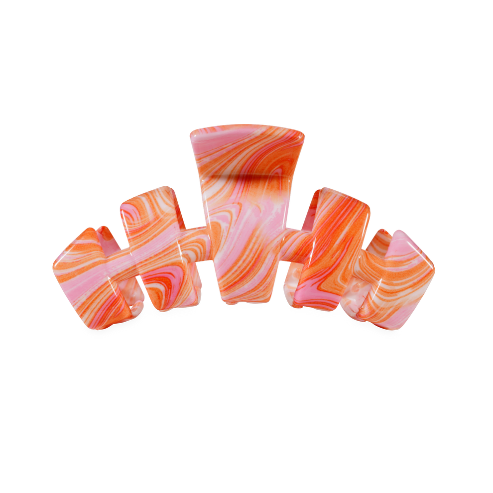 TELETIES Just Keep Swimming medium claw clip in pink and orange marbled acetate with flexible teeth.
