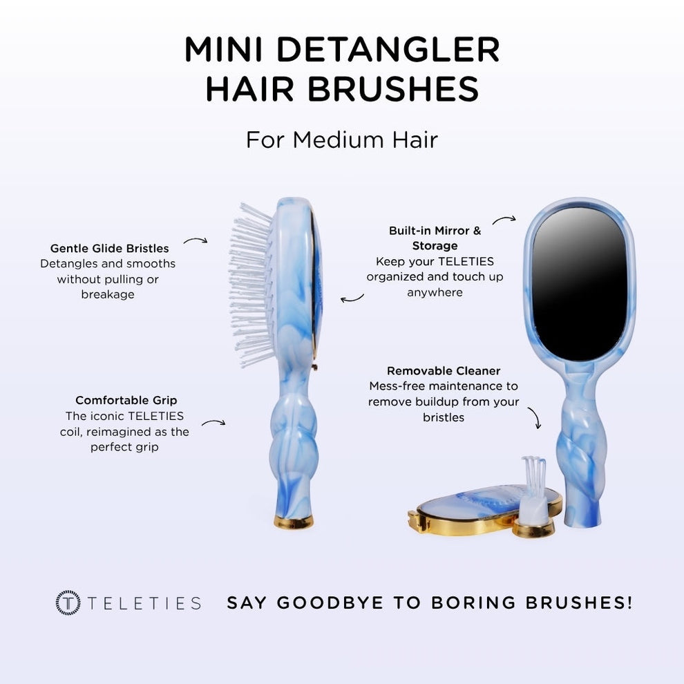 TELETIES blue and white tie-dye mini detangler hair brush with built-in mirror and storage.
