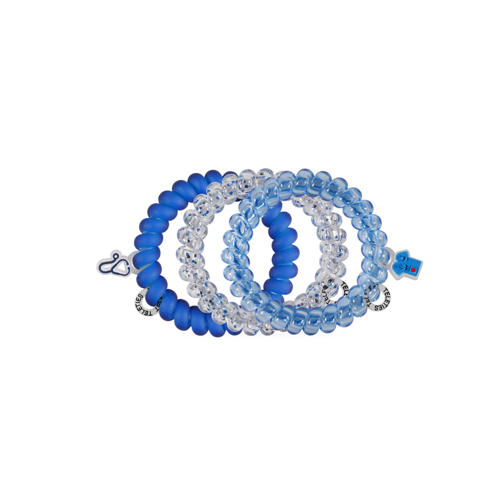 TELETIES On Call large spiral hair ties in blue and clear shades with medical-themed charms for healthcare workers.
