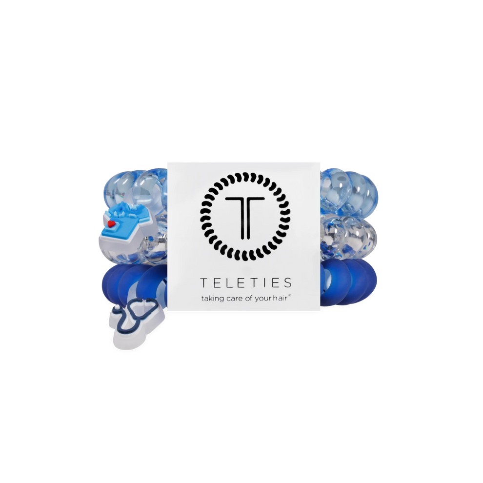 TELETIES On Call large hair ties in blue shades with medical-themed charms for healthcare professionals.
