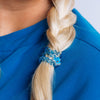 TELETIES On Call small blue spiral hair ties worn on a blonde braid, featuring a medical-themed charm.
