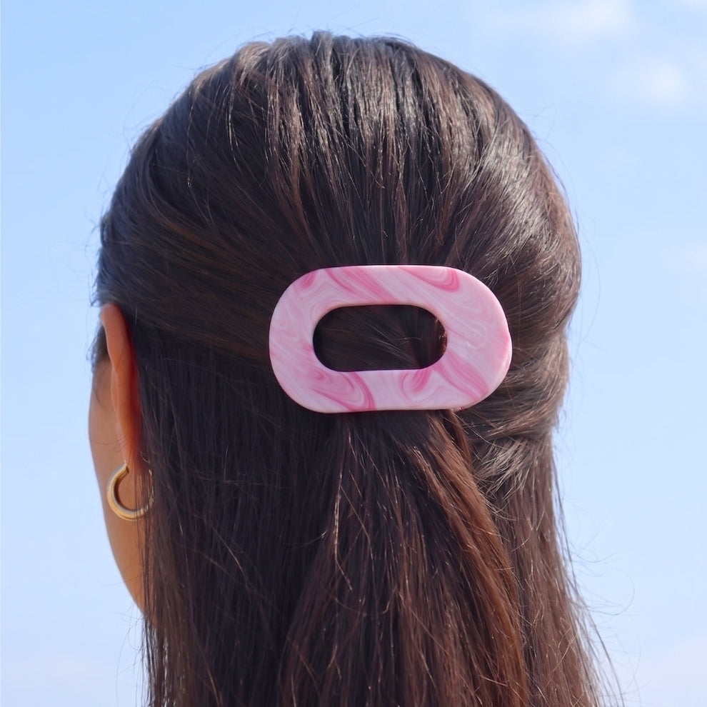 TELETIES Pinch Me! Small Flat Round Hair Clip in pink marble pattern. Designed for comfortable wear.
