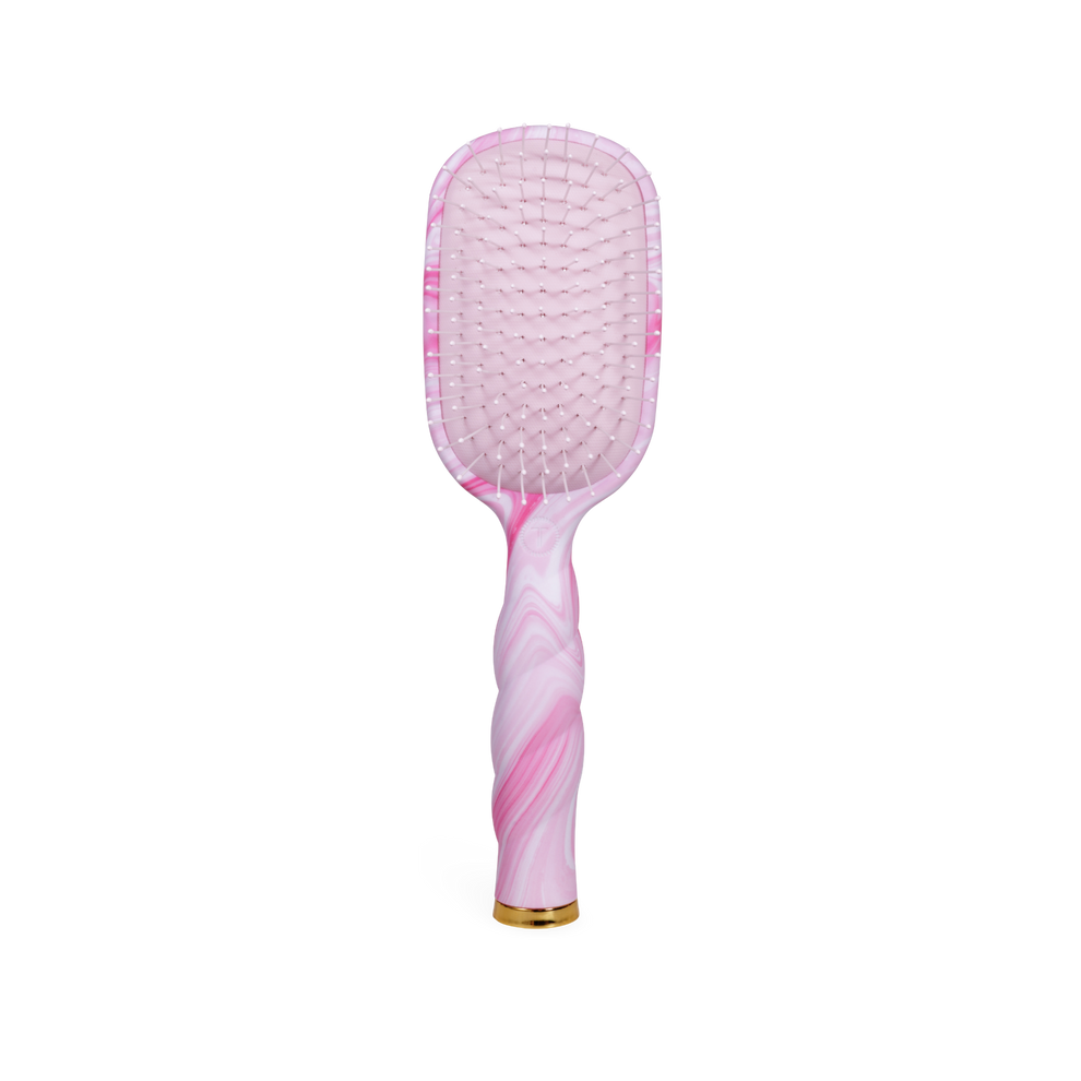 TELETIES pink tie-dye detangler hair brush for medium hair with gentle glide bristles and ergonomic coil handle.
