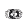 TELETIES large silk scrunchies in black and white polka dot print, featuring a strong inner coil for secure hold.

