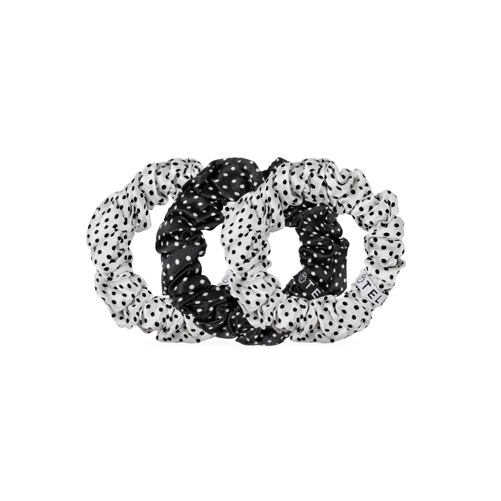 TELETIES large silk scrunchies in black and white polka dot print, featuring a strong inner coil for secure hold.

