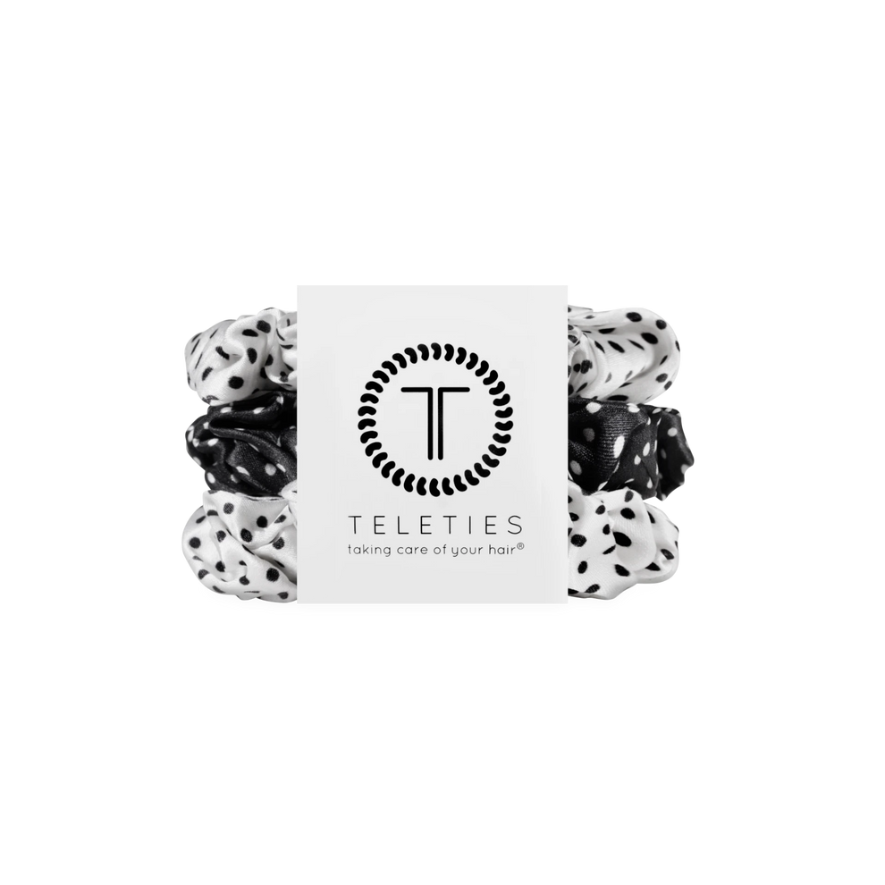 TELETIES pack of three large black and white polka dot silk scrunchies with inner coils for a secure, gentle hold.
