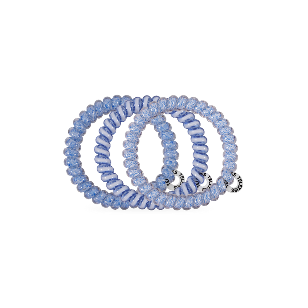 TELETIES small blue spiral hair ties with white swirls, gentle on hair and doubles as a bracelet.

